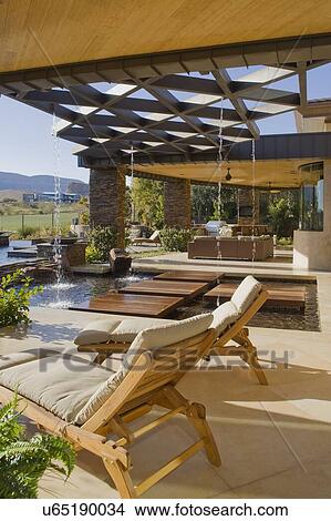 Picture - Chaise lounge in luxury patio of mansion. Fotosearch