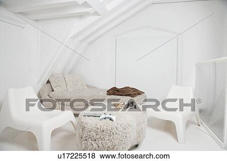 Chess board and video game controller on ottoman with chairs and sofa in room View Large Photo Image Stock Photo - Chess board and video game controller on ottoman with chairs and sofa in room. Fotosearch
