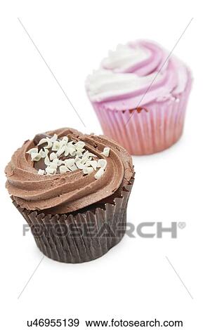 Stock Photo - Chocolate and raspberry cupcakes against white background. Fotosearch