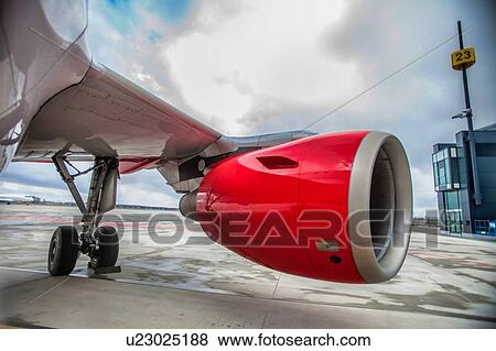 Close up of airplane engine in airport View Large Photo Image Stock Photo - Close up of airplane engine in airport. Fotosearch