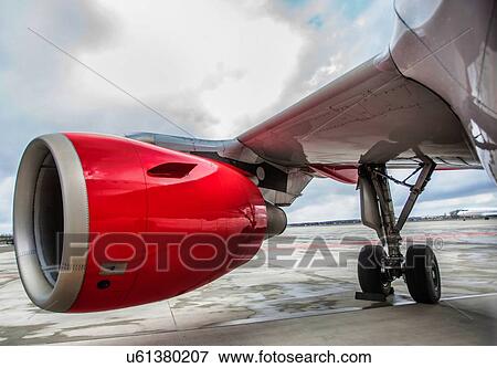 Stock Photo - Close up of airplane engine in airport. Fotosearch