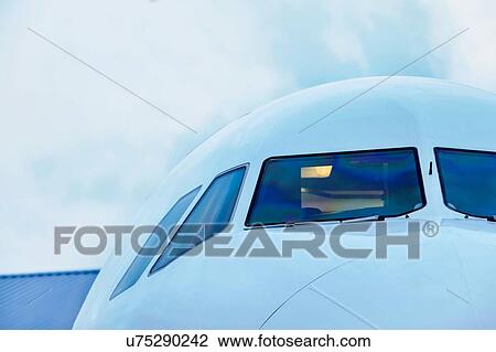 Close up of airplane in airport View Large Photo Image Stock Image - Close up of airplane in airport. Fotosearch
