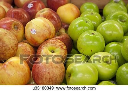 Stock Photo - Close-up of apples on display in market. Fotosearch