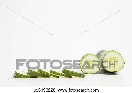 Stock Photo - Close-up of cucumber with slices. Fotosearch