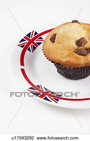 Close-up of cupcake on plate over white background View Large Photo Image Stock Image - Close-up of cupcake on plate over white background. Fotosearch