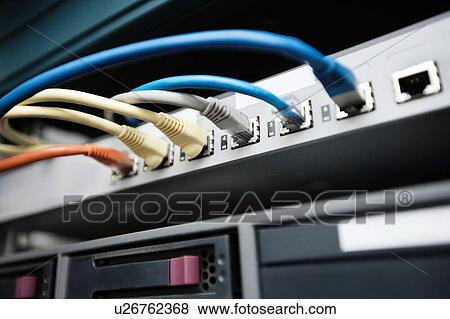 Close-up of data cable plug connected to servers in computer lab View Large Photo Image Stock Photo - Close-up of data cable plug connected to servers in computer lab. Fotosearch