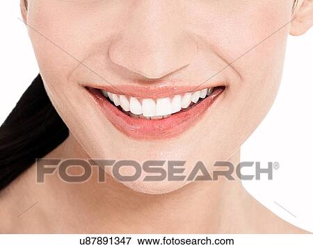 Close up of female white teeth smiling View Large Photo Image Stock Photo - Close up of female white teeth smiling. Fotosearch