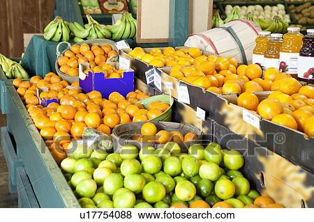 Stock Photo - Close-up of fresh fruits on display in market. Fotosearch