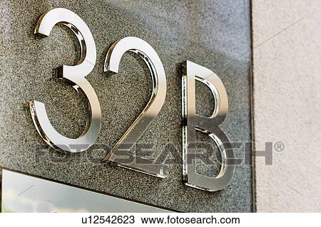Stock Image - Close up of house number 32 B. Fotosearch