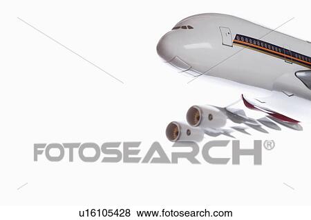 Close-up of model plane flying over white background View Large Photo Image Stock Photo - Close-up of model plane flying over white background. Fotosearch