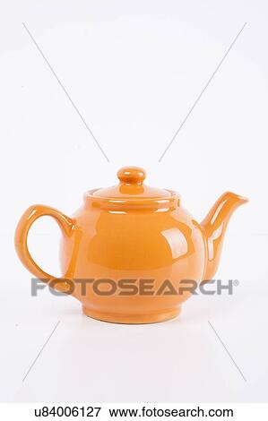 Close-up of orange kettle over white background View Large Photo Image Stock Photo - Close-up of orange kettle over white background. Fotosearch