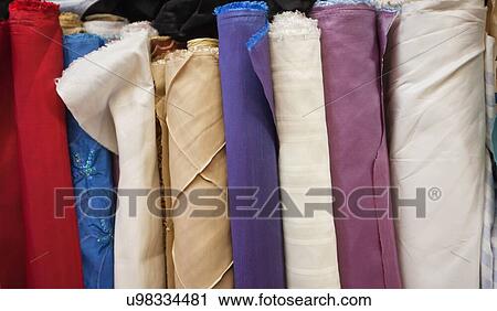 Close-up of rolled fabric cloth bolts View Large Photo Image Stock Image - Close-up of rolled fabric cloth bolts. Fotosearch