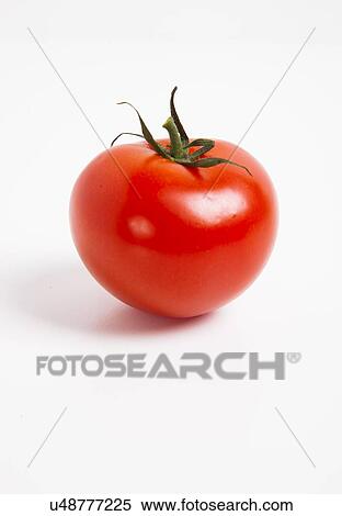 Stock Photography - Close-up of tomato over white background. Fotosearch