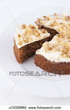 Close-up of walnut cake in plate over white background View Large Photo Image Stock Photography - Close-up of walnut cake in plate over white background. Fotosearch