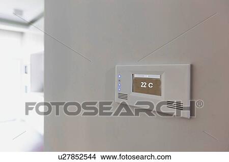 Close up photo of modern temperature touch switch board on wall View Large Photo Image Picture - Close up photo of modern temperature touch switch board on wall. Fotosearch