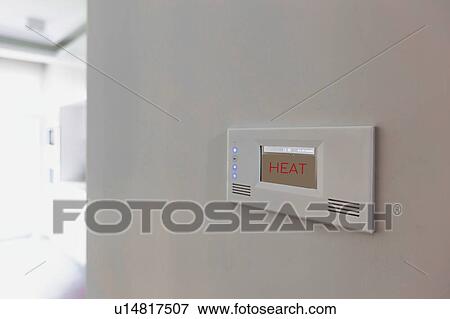 Stock Photo - Close up photo of modern temperature touch switch board on wall. Fotosearch