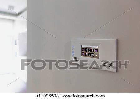 Stock Photo - Close up photo of modern touch switch board on wall. Fotosearch