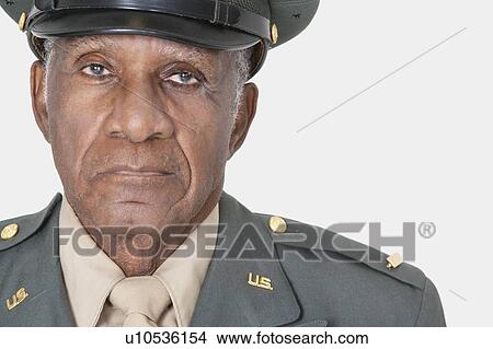 Close-up portrait of a senior male US military officer over gray background View Large Photo Image Picture - Close-up portrait of a senior male US military officer over gray background. Fotosearch
