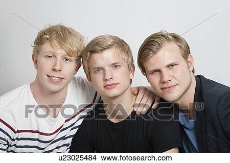 Close-up portrait of three young male friends View Large Photo Image Picture - Close-up portrait of three young male friends. Fotosearch