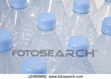 Close-up view of empty plastic bottles with blue caps View Large Photo Image Stock Image - Close-up view of empty plastic bottles with blue caps. Fotosearch