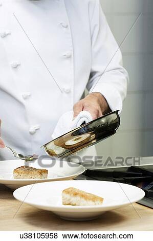 Stock Photo - Collage of Chef cooking pan fried cod in kitchen. Fotosearch