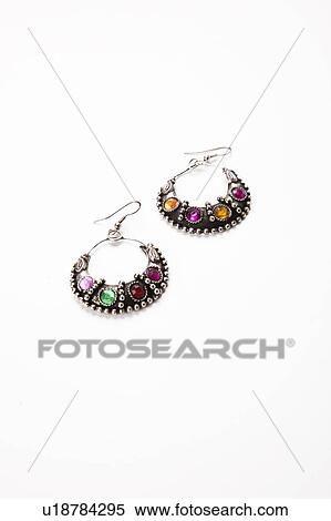 Colorful gems on earrings over white background View Large Photo Image Stock Photography - Colorful gems on earrings over white background. Fotosearch