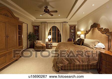 Stock Photo - Comfortable big bed in luxury manor house. Fotosearch