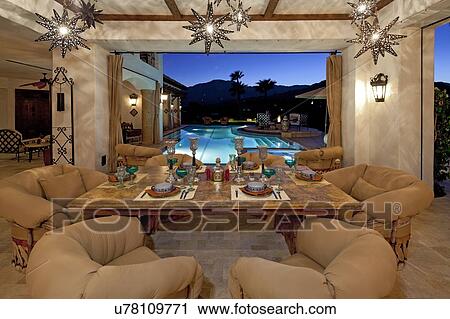 Stock Image - Contemporary dining room in mansion. Fotosearch