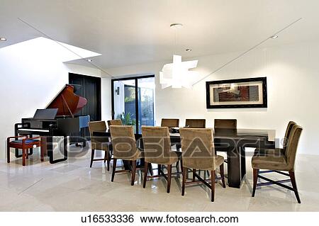 Stock Photograph - Contemporary dining room in modern mansion. Fotosearch
