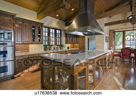 Stock Photo - Contemporary kitchen counter in luxury mansion. Fotosearch
