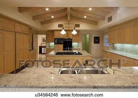 Contemporary kitchen counter in luxury house View Large Photo Image Stock Photograph - Contemporary kitchen counter in luxury house. Fotosearch