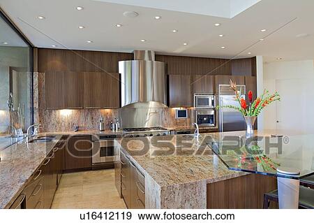 Stock Photo - Contemporary kitchen counter in mansion. Fotosearch