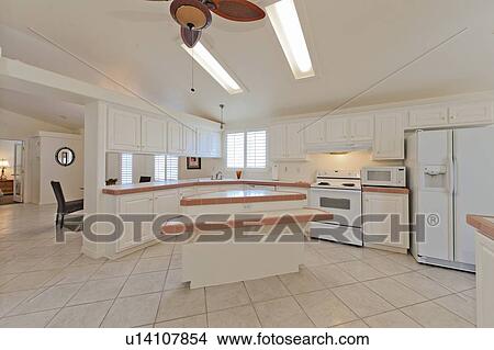 Picture - Contemporary kitchen interior in luxurious mansion. Fotosearch