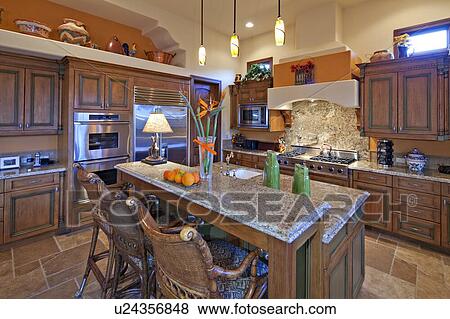 Stock Photo - Contemporary kitchen interior of luxury mansion. Fotosearch