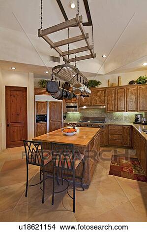 Picture - Contemporary kitchen with chairs in luxury villa. Fotosearch