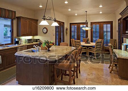 Contemporary kitchen with dining table and chair in luxury villa View Large Photo Image Stock Image - Contemporary kitchen with dining table and chair in luxury villa. Fotosearch