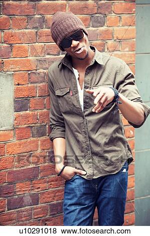 Stock Photo - Cool Urban Black Male in Beanie and Shades. Fotosearch