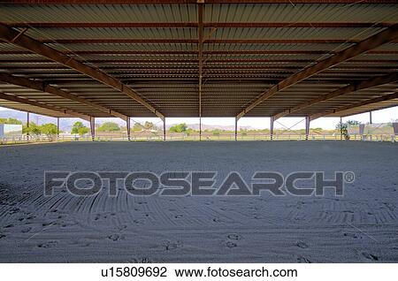 Stock Image - Covered Horse training area. Fotosearch