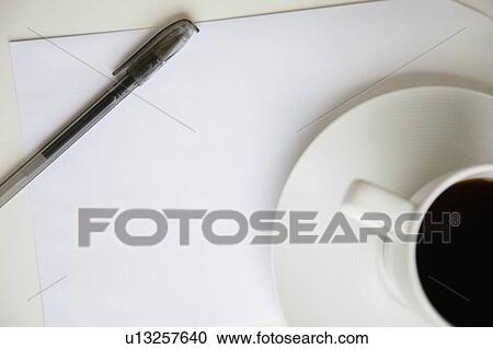 Cropped image of coffee cup with pen on a blank paper View Large Photo Image Stock Image - Cropped image of coffee cup with pen on a blank paper. Fotosearch