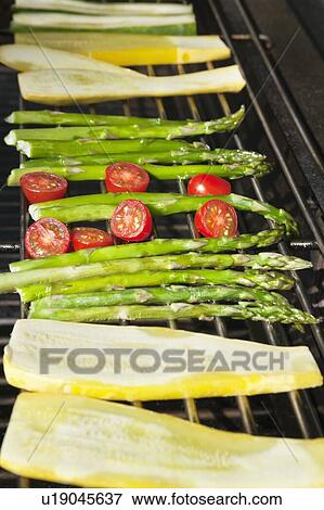 Cucumber, tomatoes and asparagus on grill View Large Photo Image Stock Photo - Cucumber, tomatoes and asparagus on grill. Fotosearch