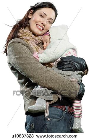 Stock Photo - Cut out of Mother smiling and holding her Baby Girl. Fotosearch