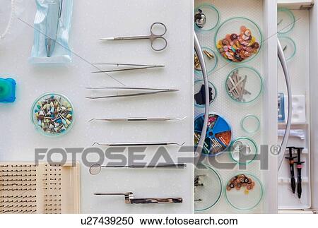 Stock Image - Dental clinic and dental instruments. Fotosearch