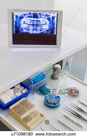 Stock Image - Dental clinic and dental instruments. Fotosearch