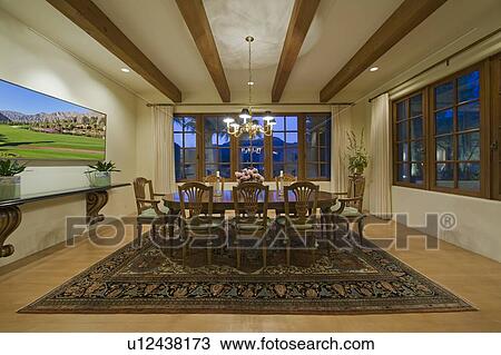Stock Image - Dining room in luxury mansion. Fotosearch