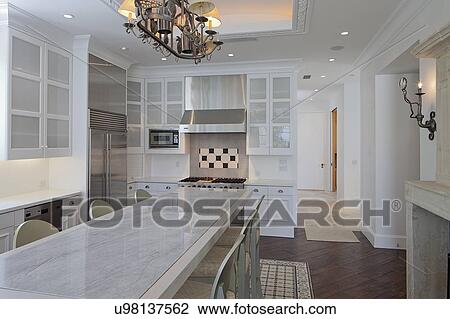 Dining table and chair in modern kitchen of luxury villa View Large Photo Image Stock Image - Dining table and chair in modern kitchen of luxury villa. Fotosearch