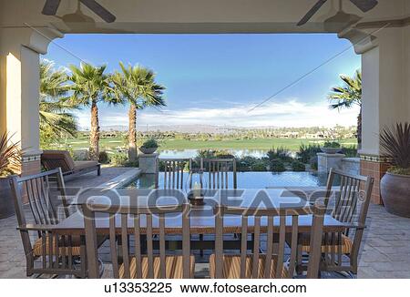 Dining table and chair in patio View Large Photo Image Stock Photography - Dining table and chair in patio. Fotosearch
