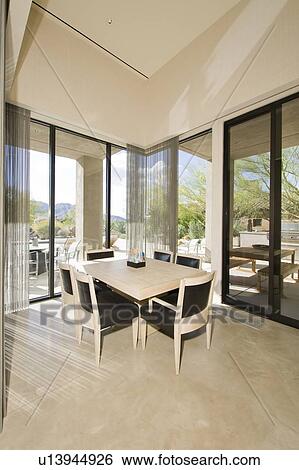 Stock Photograph - Dining table by window. Fotosearch