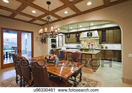 Dining table near kitchen in luxury mansion View Large Photo Image Stock Image - Dining table near kitchen in luxury mansion. Fotosearch