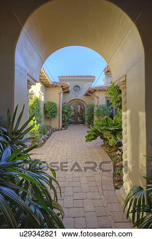 Doorway to courtyard of luxury manor house View Large Photo Image Stock Image - Doorway to courtyard of luxury manor house. Fotosearch