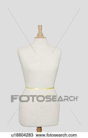 Stock Image - Dressmaker's model against gray background. Fotosearch